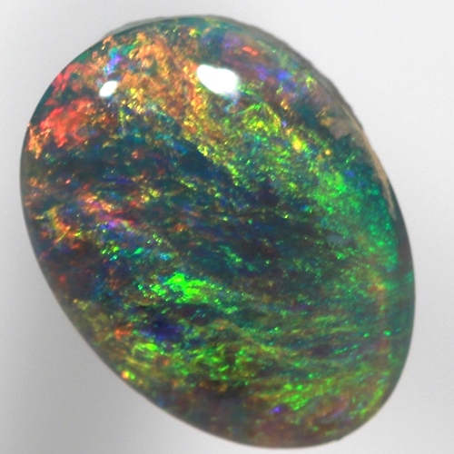SOLID SEMI BLACK OPAL Pinfire pattern of orange green and blue